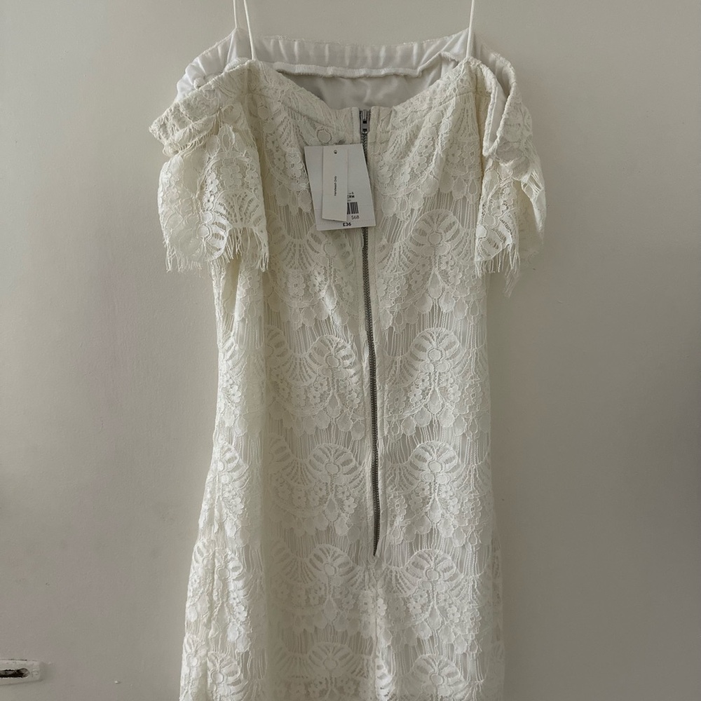 Little white dress so cute with boots or high heels..never worn